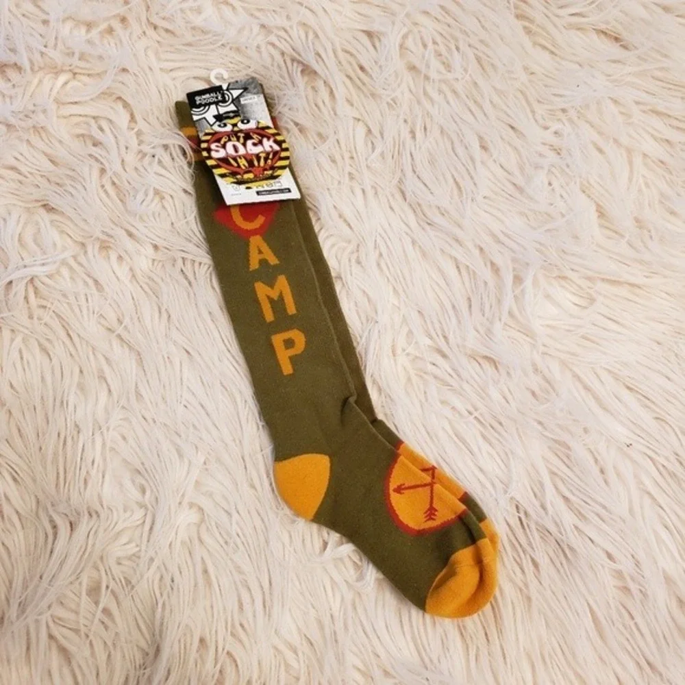 socks that read Camp in gold letters‎